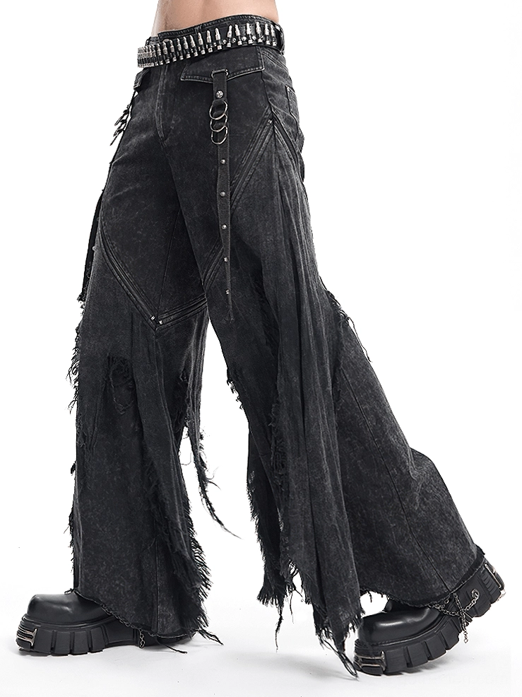 Three-quarter front view of black distressed gothic jeans styled with alternative fashion aesthetic