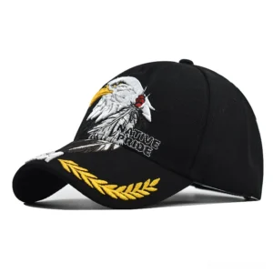 Black gothic eagle embroidered baseball cap with native pride text and golden wheat trim brim detail left front three-quarter view
