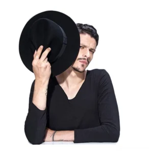Close-up of black premium wool felt fedora hat, showing soft texture and craftsmanship detail