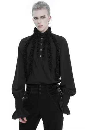 Black ruffled gothic shirt front view on model, featuring layered frilly panels and smocked cuffs, stand collar