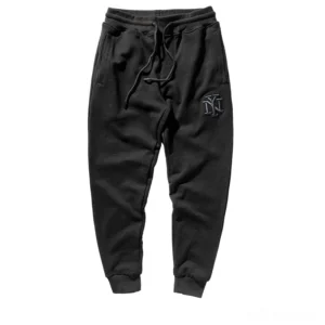 Black gothic harem joggers with NY embroidery logo, flat lay front view, alternative sweatpants for men