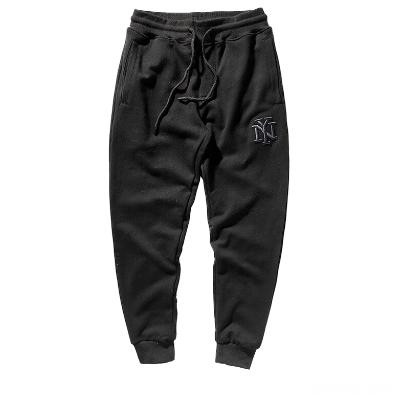 Black gothic harem joggers with NY embroidery logo, flat lay front view, alternative sweatpants for men