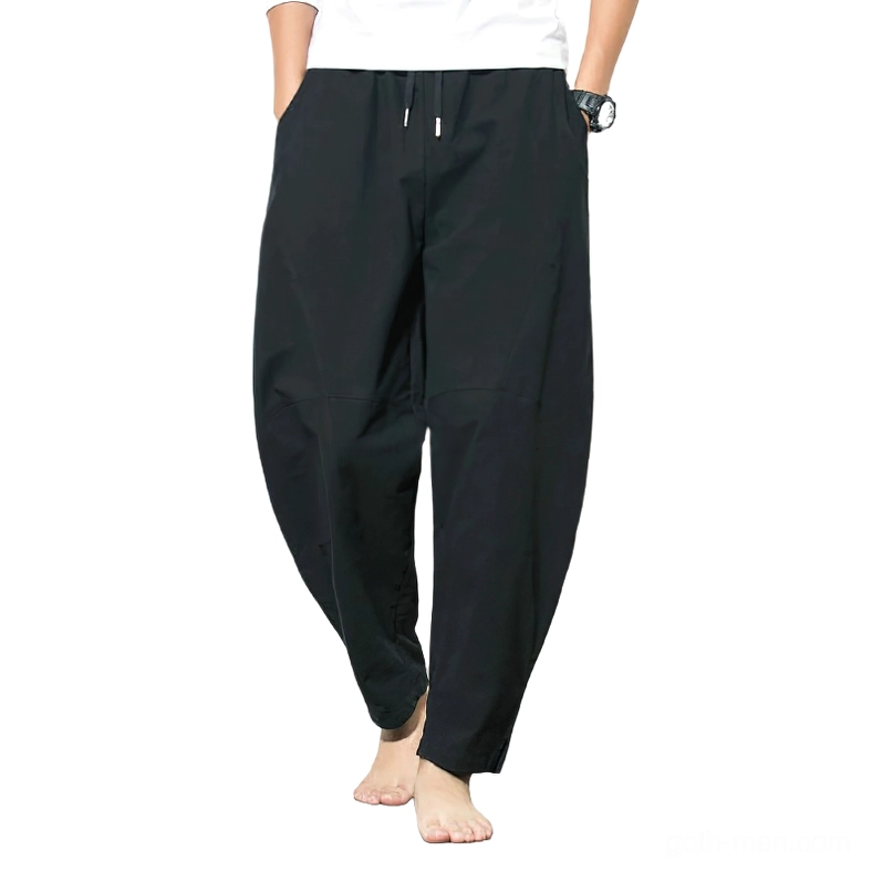 Black gothic linen harem pants front view with drawstring waist and side pockets
