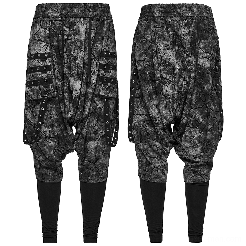 Black tie-dye gothic harem pants flat lay rear view showing attached black leggings lining and eyelet hardware