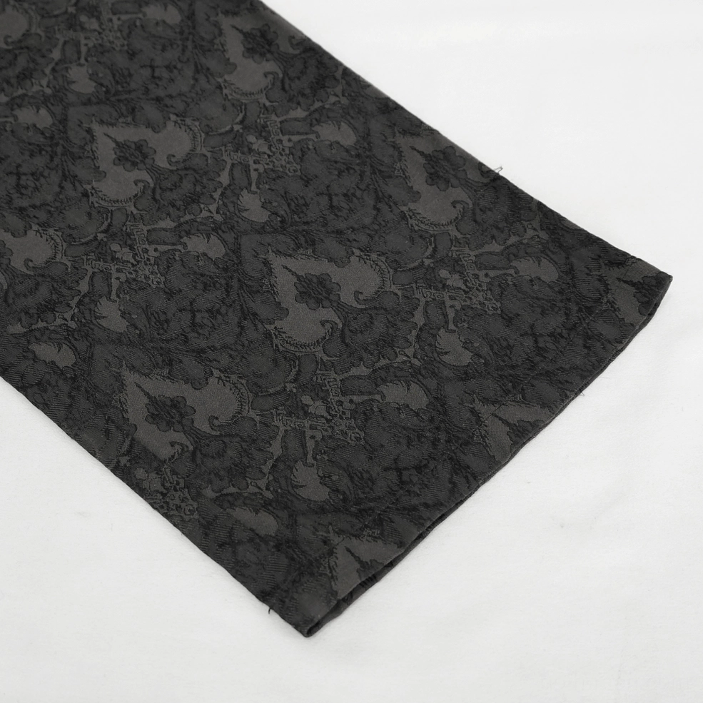 Black jacquard gothic high-waist trousers on model wearing styled dark alternative fashion outfit