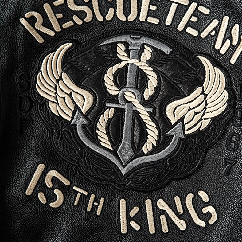 Black gothic embroidered leather jacket showing multiple patch placement and tactical design elements