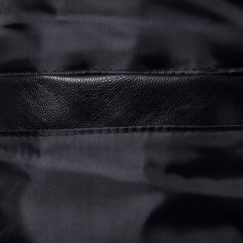 Interior satin lining of gothic leather jacket showing neat stitching and construction