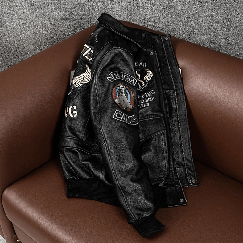 Black leather gothic motorcycle jacket side hanging view showing zipper front closure and embroidered tactical details