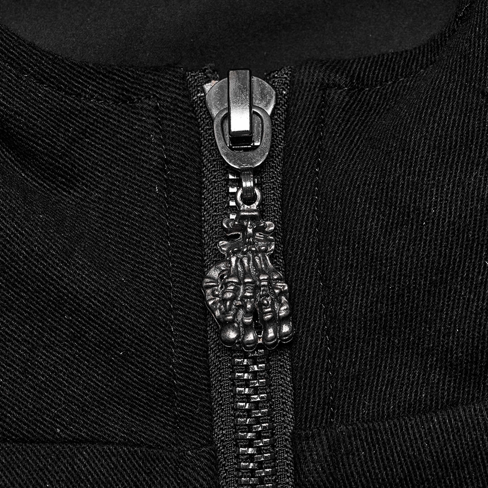 Black gothic jacket macro detail of gunmetal skull zipper pull hardware on front closure