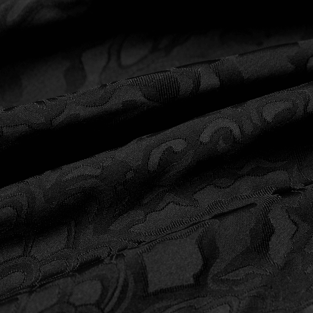 Close-up texture of woven damask jacquard fabric showing black gothic shirt material quality