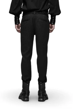 Black gothic jacquard slim-fit pants rear view showing tapered hem, welt back pockets, and red waistband detail