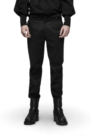 Black gothic jacquard slim-fit pants front full-body view on male model, featuring red lace waist detail and metal buttons