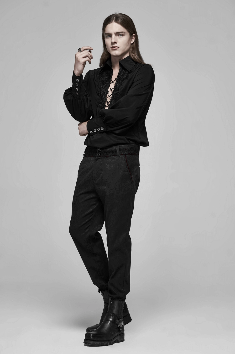 Black gothic jacquard slim-fit pants with red lace detail full garment shot displaying Victorian gothic craftsmanship and tapered design