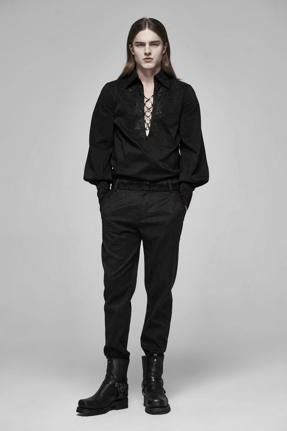 Black gothic jacquard slim-fit pants hem detail showing tapered leg, metal button closure, and quality seaming of alternative fashion trousers