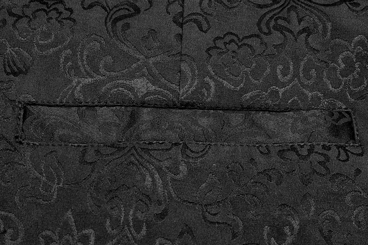 Black gothic jacquard slim-fit pants leg profile showing tapered hem, metal buttons, and slim-fit construction for alternative fashion