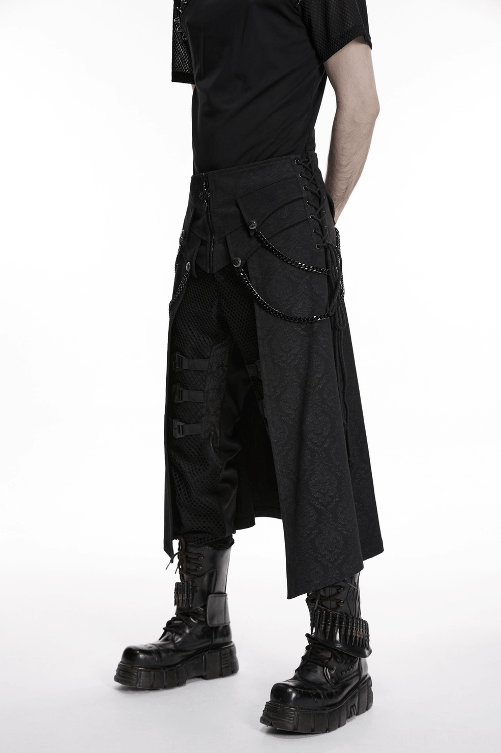 Black gothic kilt lower hem and panel construction flat lay displaying layered details and chain embellishments