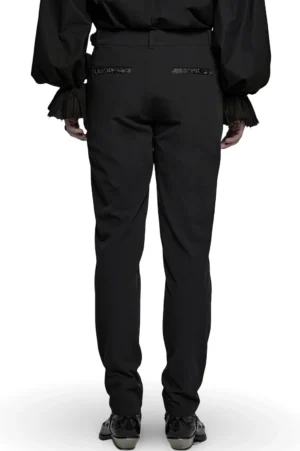 Black gothic lace trousers rear view on male model, displaying embroidered back waistband and vintage buckle waist system