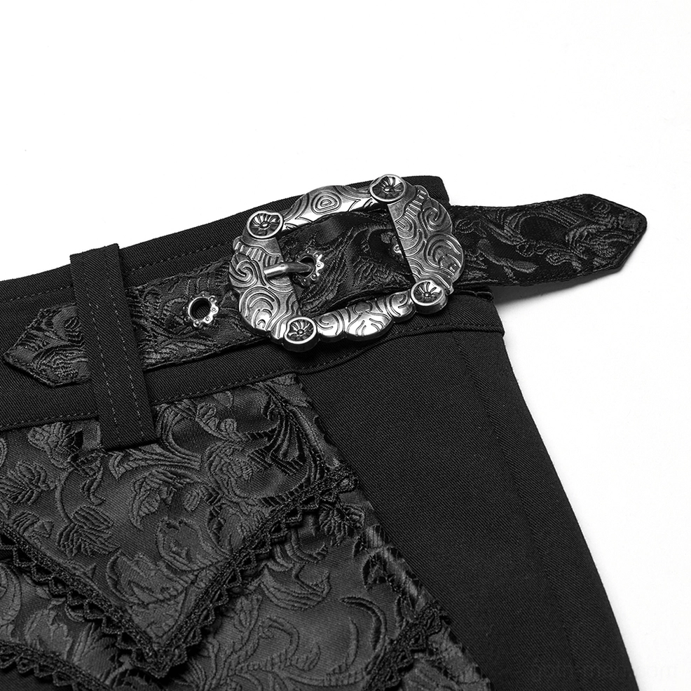 Black gothic lace trousers waist belt close-up, showing carved vintage buckle, embossed leather strap and ornamental lace embellishments