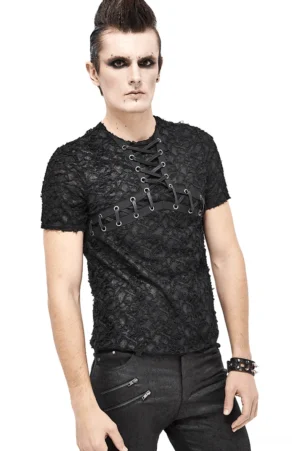 Black gothic lace-up men's t-shirt with cracked texture and metal eyelets, modeled from front three-quarter angle by punk styled male