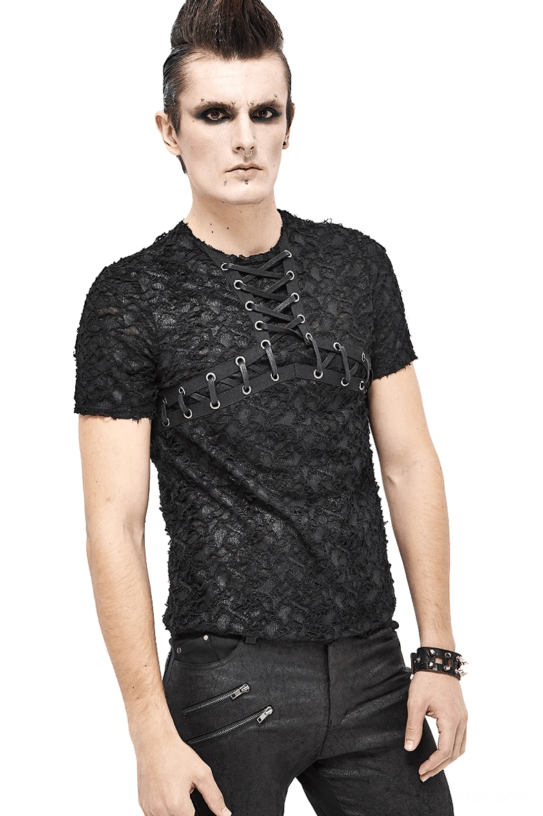 Black gothic lace-up men's t-shirt with cracked texture and metal eyelets, modeled from front three-quarter angle by punk styled male