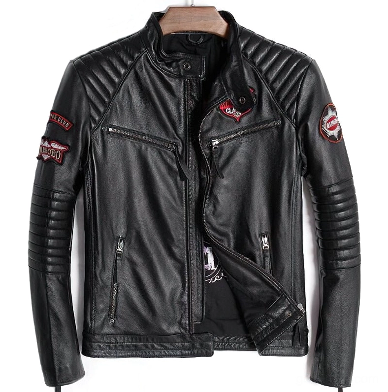 Black leather gothic motorcycle jacket front view on wooden hanger showing zippered pockets and embroidered patches