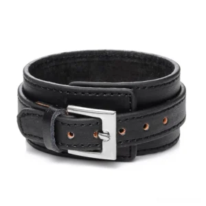 Black gothic leather cuff bracelet with silver stainless steel buckle, double-layer strap design, flat lay studio view