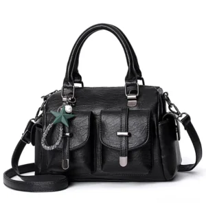 Black gothic leather shoulder bag with star pendant, dual front pockets, and removable strap – celestial vintage handbag