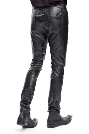 Back view of black slim fit synthetic leather trousers showing rear pocket design and sleek fit