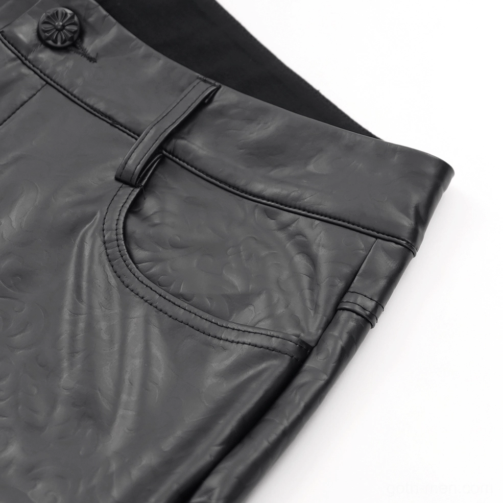 Detailed view of black synthetic leather pants side seam stitching and embossed leather texture
