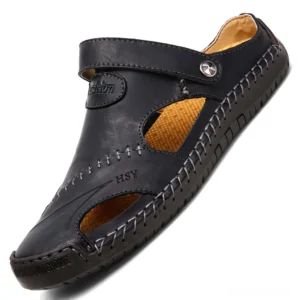 Black genuine leather gothic buckle sandals for men with closed toe design and hand-stitched details, side view