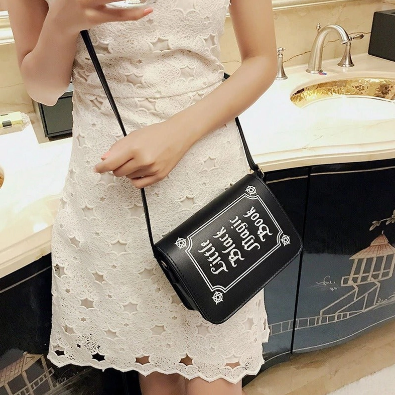 Black gothic letter crossbody bag showcasing dark aesthetic and alternative fashion appeal