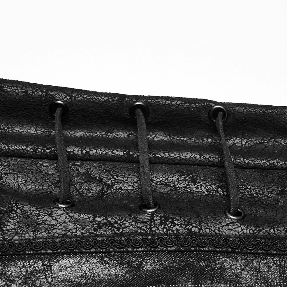 Close-up of black gothic pants side lace-up with nylon laces, metal eyelets, and embroidered trim detail