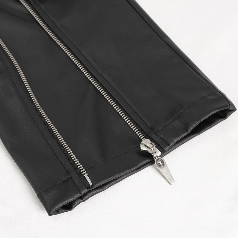 Extreme close-up of faux leather pants hem featuring metal zipper with unique pull tab and detailed synthetic leather material