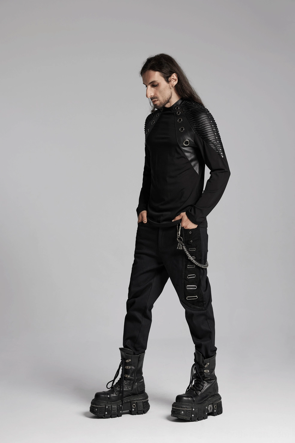 Detailed product view of black gothic long-sleeve top with industrial metal accents