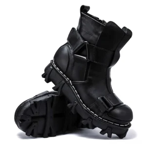 Black gothic punk leather ankle boots with buckle straps and polished toe cap, chunky rubber lug sole - side and bottom view