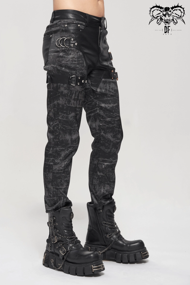 Black gothic punk trousers with fitted silhouette and industrial leather detailing, angled display