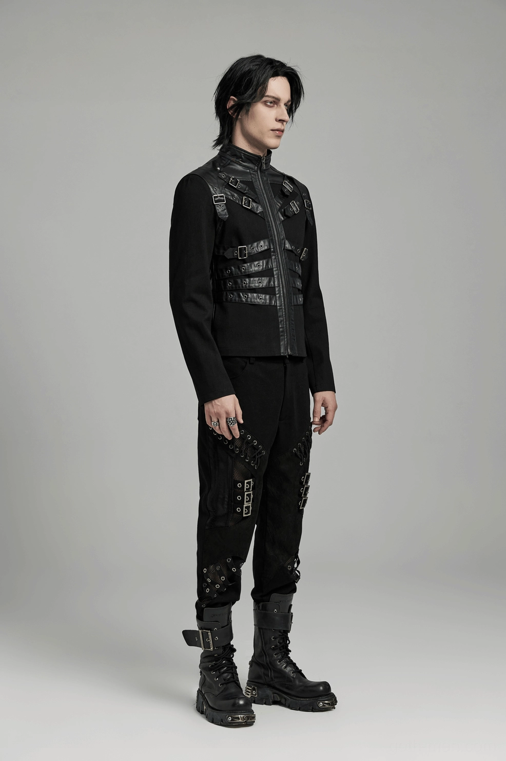 Black gothic punk jacket full back view flat lay, emphasizing strap system and rubberized fabric texture