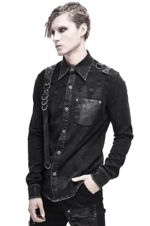 Black gothic punk shirt with torn mesh and PU leather straps worn by male model, front three-quarter view showing metal hardware and distressed fabric details