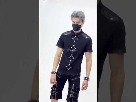 Black gothic punk short sleeve shirt worn with bondage shorts and accessories on masked punk model