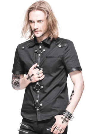 Black gothic punk short sleeve shirt front three-quarter view on male model with leather shoulder epaulets and metal stud accents