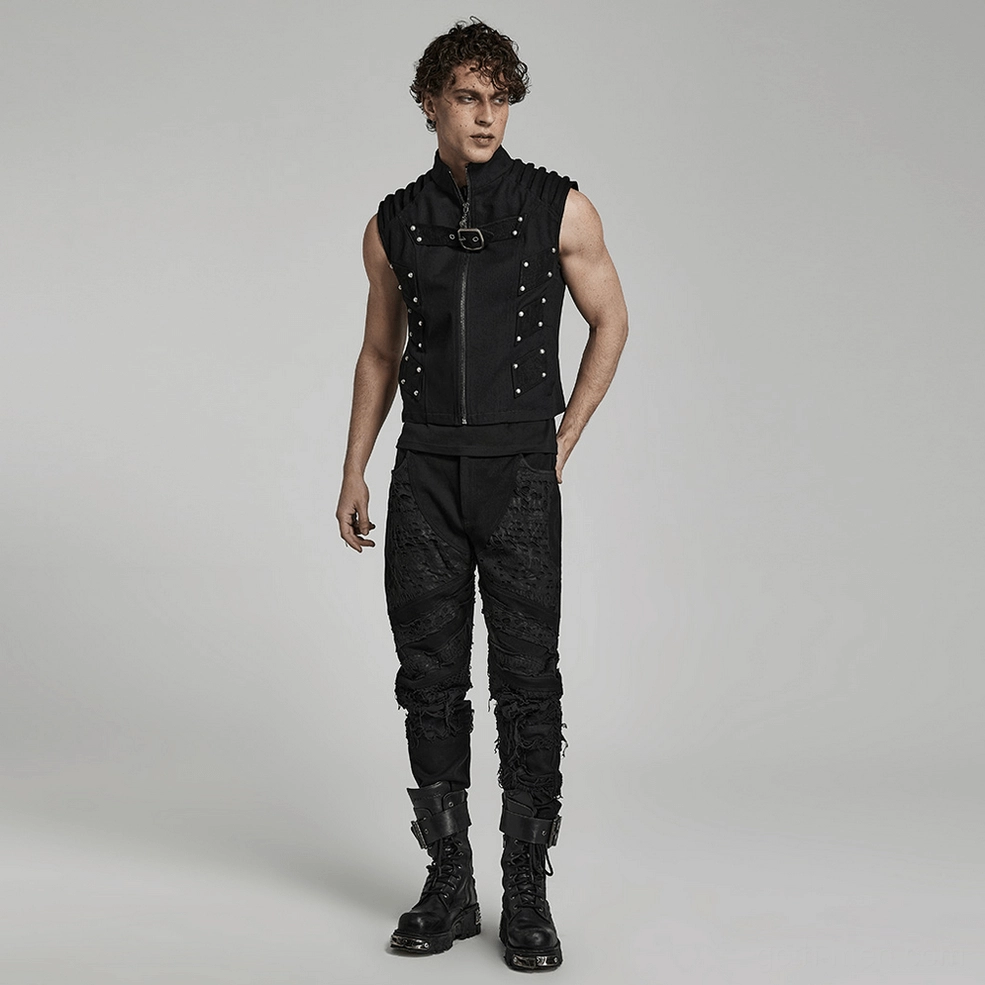 Black studded gothic punk vest on model, full-length shot emphasizing fitted silhouette and architectural shoulder structure