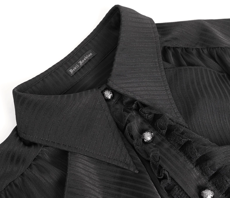 Close-up detail of black gothic shirt collar tag and ornamental gem buttons on ruffled placket trim