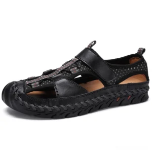 Black gothic sandals front three-quarter angle showing breathable mesh panels and anti-slip textured rubber outsole