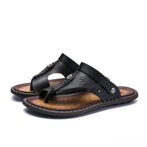Black gothic microfiber sandals with metal rivets and embossed detailing - three-quarter side view studio shot