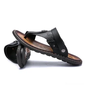 Black alternative fashion microfiber sandals stacked display with embossed logo - low angle view