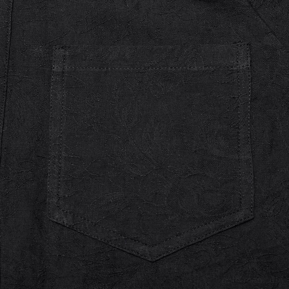 Black lace-up gothic shirt for men - close-up detail of stitched chest pocket on embroidered black fabric