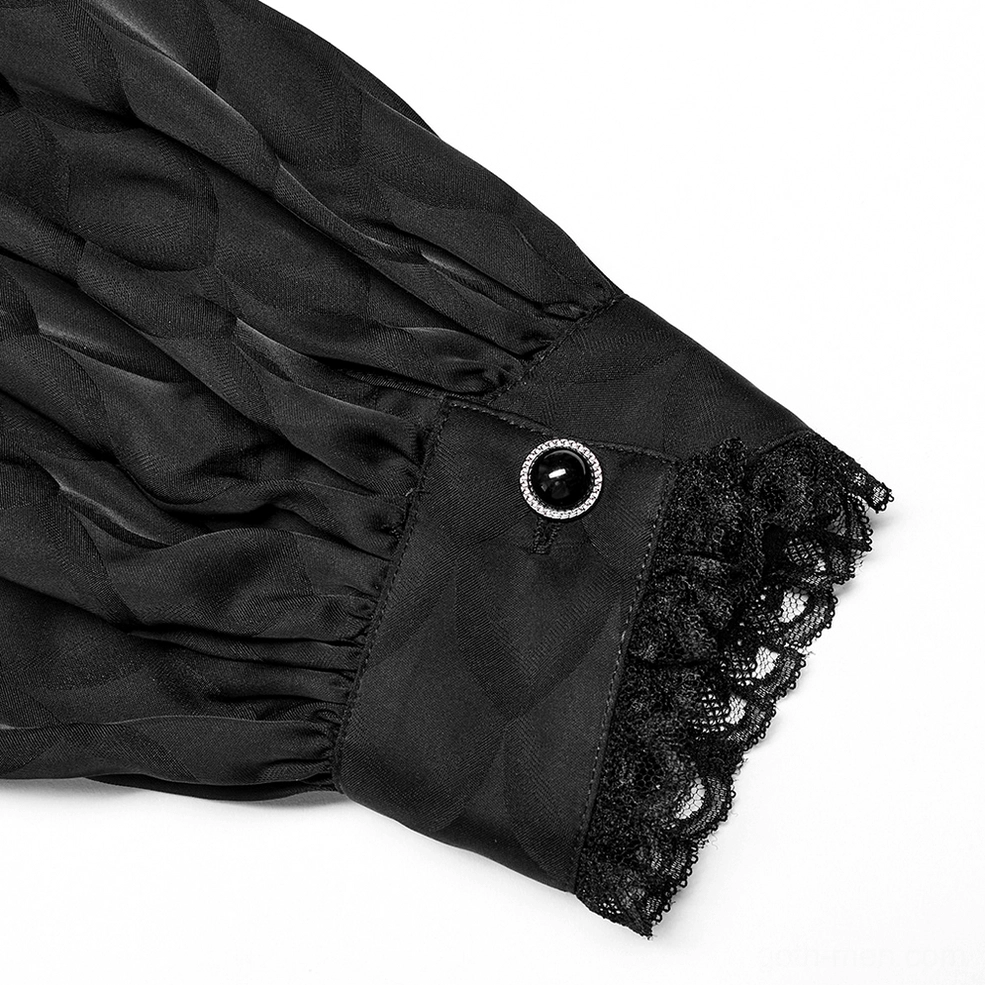 Close-up detail of black gothic shirt cuff with lace trim and decorative button