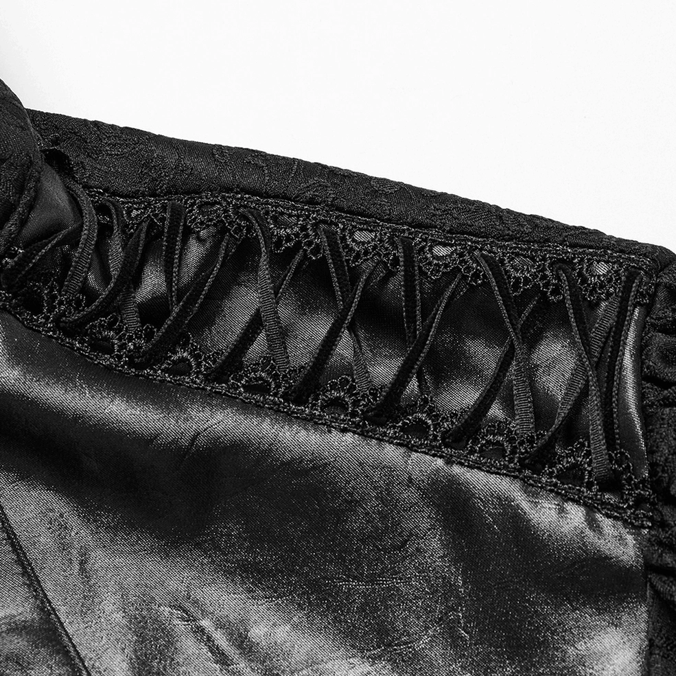 Black gothic shirt close-up detail showing lace trim crisscross strap design and intricate stitching