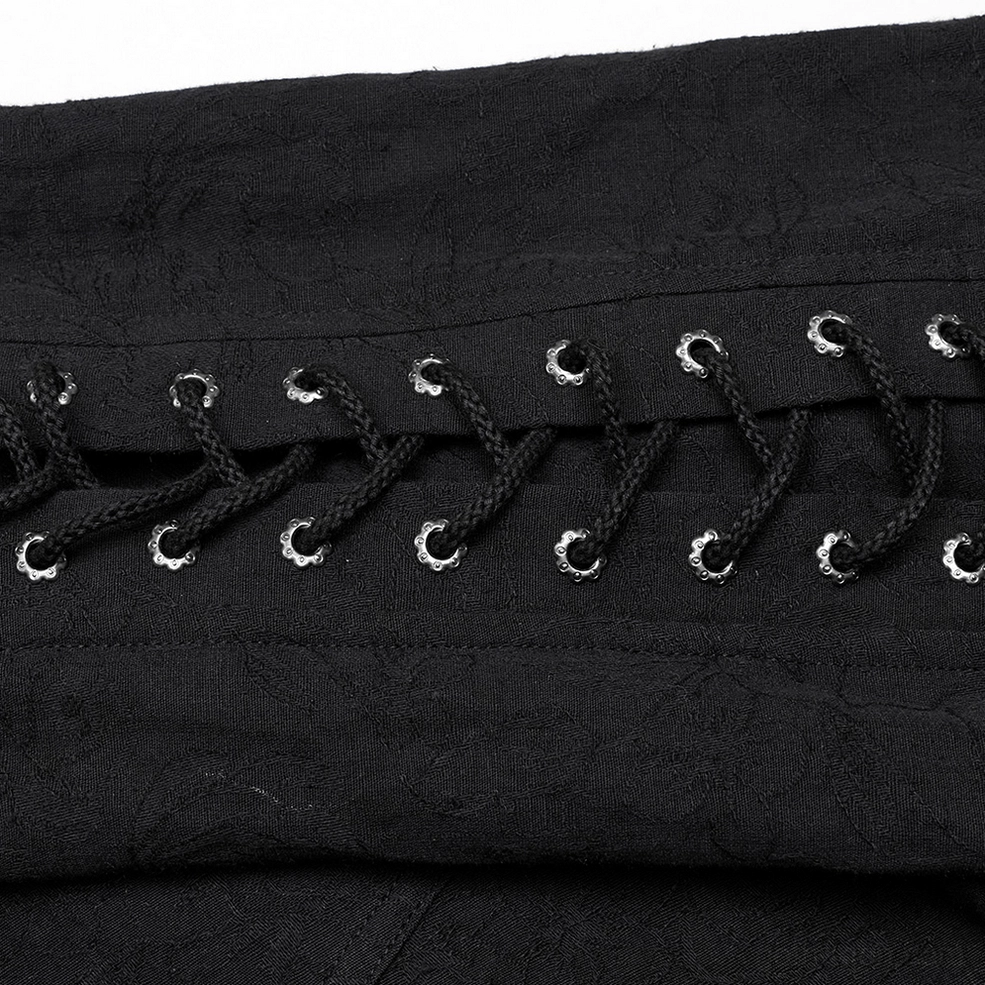 Black lace-up gothic shirt for men - close-up detail of shoulder lace-up mechanism with metal eyelets and braided cord