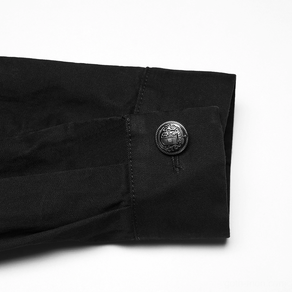 Close-up detail of black gothic shirt shoulder featuring metal zipper trim and black twill fabric texture